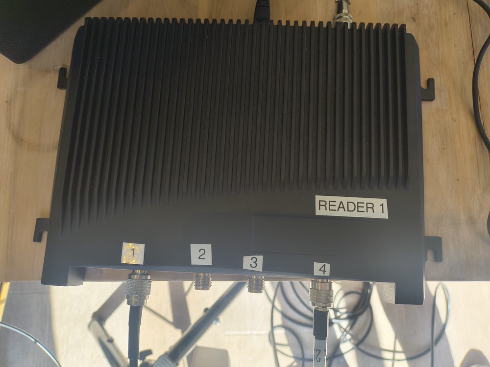 Black finned RFID reader labelled Reader 1 with four numbered antenna ports